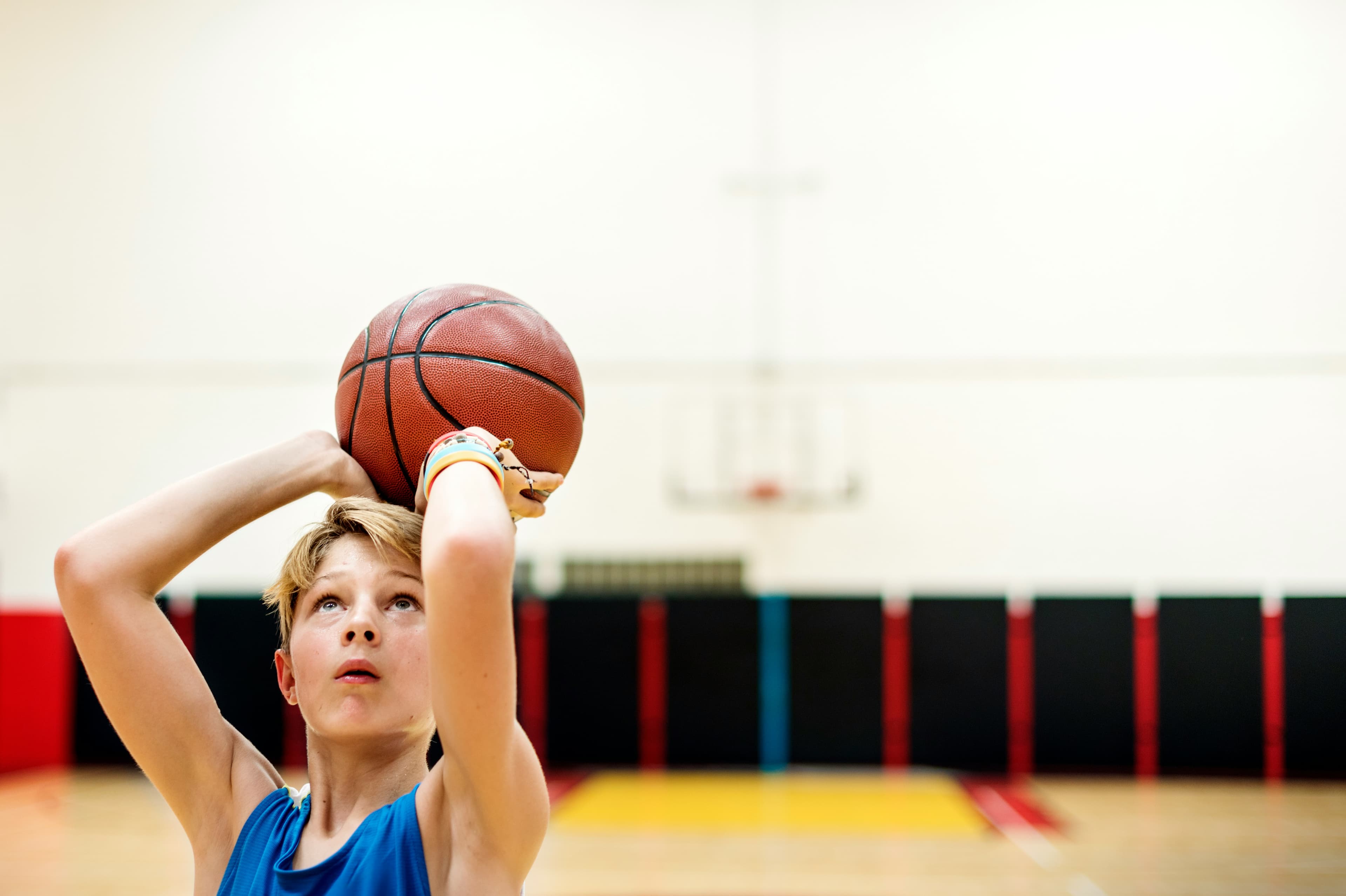 Young basketball players practicing shooting in Calgary